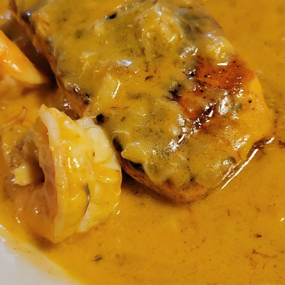 Frilly's Seafood Bayou Kitchen - Salmon with st. Andrew's sauce - Cajun/Creole Near Me - Denton, Texas Frilly's Seafood Bayou Kitchen - Salmon with st. Andrew's sauce - Cajun/Creole Near Me - Denton, Texas