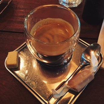 A Casa do Porco Bar - Espresso with a small piece of cheese and a side of bacon caramel. - Bars Near Me - São Paulo, SP