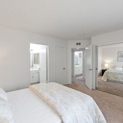 The Hallmark - A bedroom with a spacious mirrored closet doors at the Hallmark Apartment in Sherman Oaks
