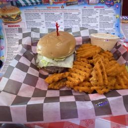 Smash burger with sweet potato fries added on the side.