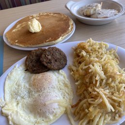 MVP breakfast. My order contained two over-medium eggs, sausage patties, hash browns, biscuits n' gravy, and one pancake. MVP breakfast. My order contained two over-medium eggs, sausage patties, hash browns, biscuits n' gravy, and one pancake.