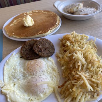 Huddle House - MVP breakfast. My order contained two over-medium eggs, sausage patties, hash browns, biscuits n' gravy, and one pancake. - Breakfast & Brunch Near Me - Hinesville, Georgia