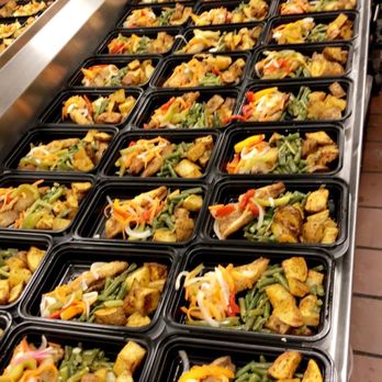 Mae Mae Cafe - trays of food on a conveyor belt - Vegan Near Me - Bronx, New York Mae Mae Cafe - trays of food on a conveyor belt - Vegan Near Me - Bronx, New York