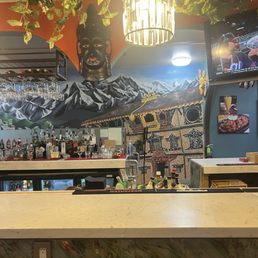 Fun mural on the entry wall behind the bar. Fun mural on the entry wall behind the bar.
