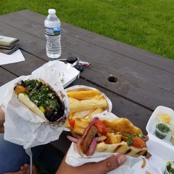 Chellas Arepa Kitchen - Lomo Arepa (right) and Vegatarrino (left) with a side of yuca fries. - Venezuelan Near Me - Lancaster, Pennsylvania