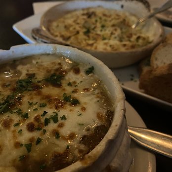 Wilde Bar & Restaurant - Baked French Onion Soup and artichoke dip in the background - Pubs Near Me - Chicago, Illinois Wilde Bar & Restaurant - Baked French Onion Soup and artichoke dip in the background - Pubs Near Me - Chicago, Illinois
