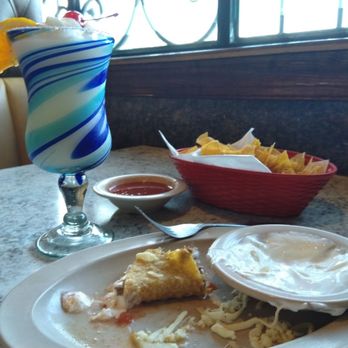 Los Arcos - My mostly eaten taco with sour cream, a pina colada, and tortilla chips & salsa. - Mexican Near Me - Gastonia, North Carolina Los Arcos - My mostly eaten taco with sour cream, a pina colada, and tortilla chips & salsa. - Mexican Near Me - Gastonia, North Carolina