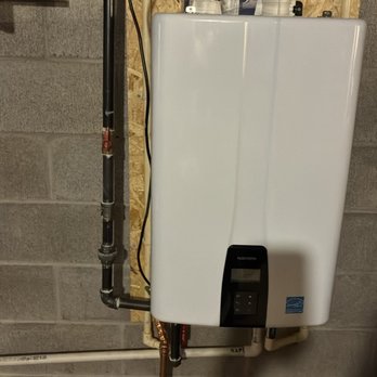 Bluefrog Plumbing + Drain - Tankless water heater installation with venting, water lines, and gas connection visible. - Plumbing Near Me - North Royalton, Ohio Bluefrog Plumbing + Drain - Tankless water heater installation with venting, water lines, and gas connection visible. - Plumbing Near Me - North Royalton, Ohio
