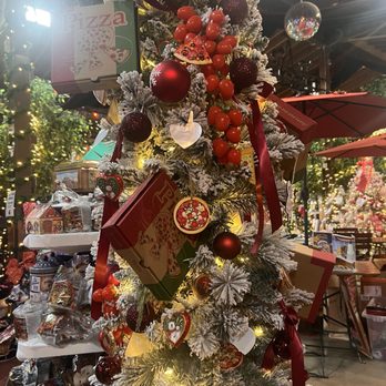 Biergarten at Old World - One of the Christmas trees and the 10,000 square-foot Christmas market! A little pizza inspiration! - German Near Me - Huntington Beach, California