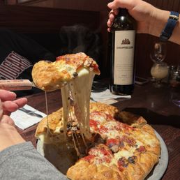 Gambino's 14" Gambino and wine.