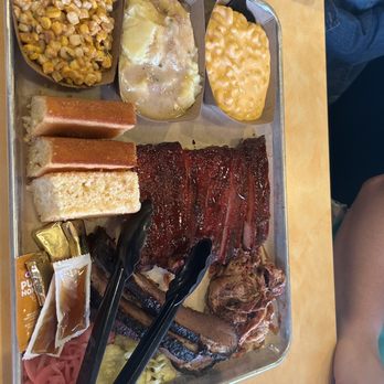 Porky Butts BBQ - Platter with ribs, brisket, pulled pork. sides of mac and cheese, corn and Mashed Potatoes & Gravy - Barbeque Near Me - Omaha, Nebraska Porky Butts BBQ - Platter with ribs, brisket, pulled pork. sides of mac and cheese, corn and Mashed Potatoes & Gravy - Barbeque Near Me - Omaha, Nebraska