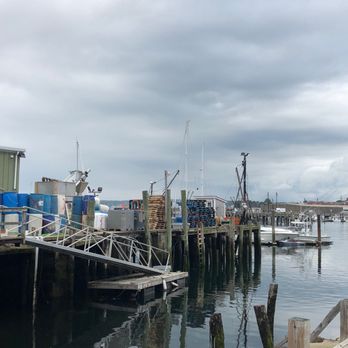 Capt Joe & Sons - a dock with several boats - Seafood Markets Near Me - Gloucester, Massachusetts
