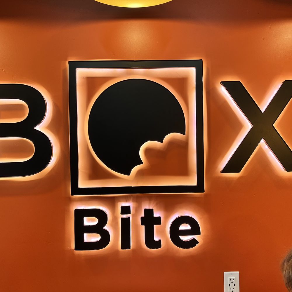Box Bite - a group of people sitting at a table - Pizza Near Me - American Fork, Utah Box Bite - a group of people sitting at a table - Pizza Near Me - American Fork, Utah