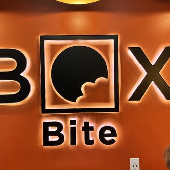 Box Bite - a group of people sitting at a table - Pizza Near Me - American Fork, Utah Box Bite - a group of people sitting at a table - Pizza Near Me - American Fork, Utah