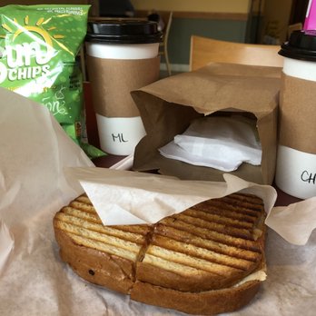 Eon Coffee - A hot Chipotle Chicken Panini (and a fresh pickle slice in the bag) with a Chai Tea Latte (right) and Matcha Latte (left). - Coffee & Tea Near Me - Hayward, California Eon Coffee - A hot Chipotle Chicken Panini (and a fresh pickle slice in the bag) with a Chai Tea Latte (right) and Matcha Latte (left). - Coffee & Tea Near Me - Hayward, California