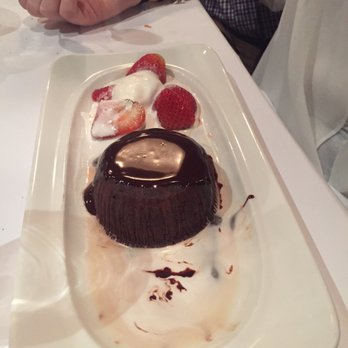 Le Marais - They brought dessert, but forgot to clear the table first. They put all the desserts on the side, cleared the table and handed us THIS. - French Near Me - New York, New York