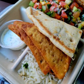 CAVA - Kid's Pita Meal White Rice  Pita Chips/tzatziki grilled chicken,  corn, tomato/cucumber , dill yogurt, and Greek vinaigrette. - Mediterranean Near Me - Dallas, Texas