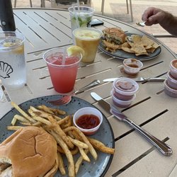 The Oasis at The Lodge and Club - Fish sandwiches, lots of extra sauces and really great beverages. Will repeat.