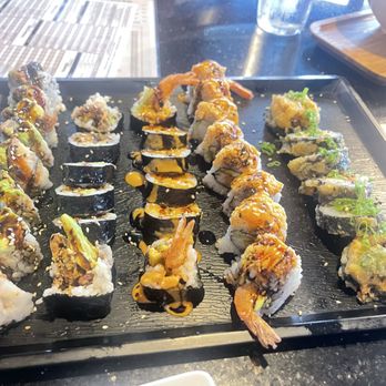 Tsukimi - Dragon roll, spider roll, shrimp tempura, tiger roll, over the rainbow roll (deep fried). - Sushi Bars Near Me - Austin, Texas Tsukimi - Dragon roll, spider roll, shrimp tempura, tiger roll, over the rainbow roll (deep fried). - Sushi Bars Near Me - Austin, Texas