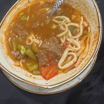 Union Bistro - Lagman noodle soup. 3 people at the table hated this, 1 person loved it. A tad spicy. - Desserts Near Me - Queens, New York