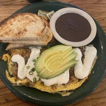 Bouldin Creek Cafe - Potato, Leek & Chorizo omelette with Avocado, Refried black beans and Sour Dough toast. - Vegetarian Near Me - Austin, Texas Bouldin Creek Cafe - Potato, Leek & Chorizo omelette with Avocado, Refried black beans and Sour Dough toast. - Vegetarian Near Me - Austin, Texas