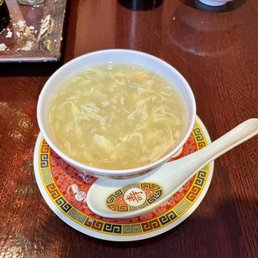 a bowl of soup on a plate a bowl of soup on a plate