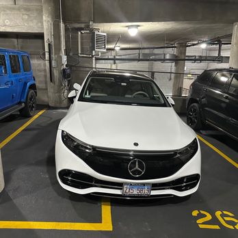 Highlights Chicago - New EV wallbox on left of car. - Electricians Near Me - Chicago, Illinois