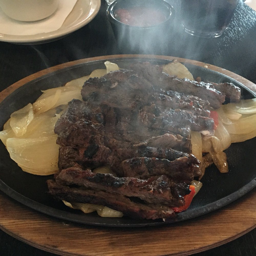Beef fajitas served on sizzling skillet! Beef fajitas served on sizzling skillet!