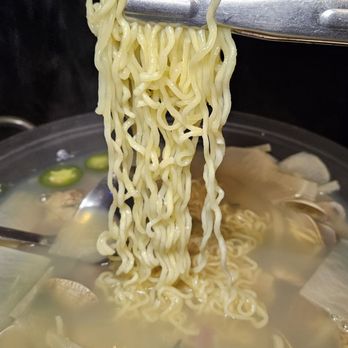 Pocha 55 - Clam Stew w added ramen - Bars Near Me - Duluth, Georgia
