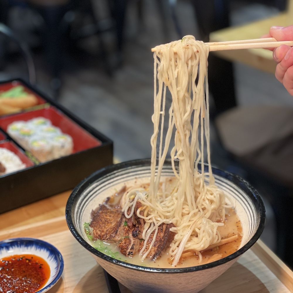 Kiori kitchen - a person holding chopsticks over a bowl of noodles - Japanese Near Me - Morris Plains, New Jersey Kiori kitchen - a person holding chopsticks over a bowl of noodles - Japanese Near Me - Morris Plains, New Jersey