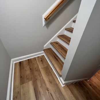 Gomez Flooring - a view of a wooden staircase - Flooring Near Me Gomez Flooring - a view of a wooden staircase - Flooring Near Me