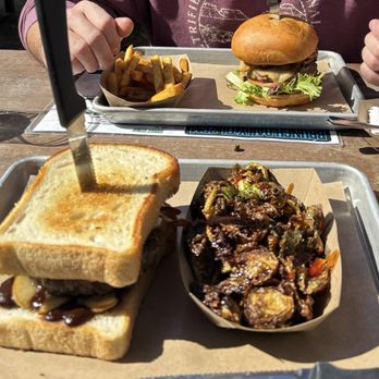 Dos Sirenos Brewing - Apple, brie, bacon burger + brussel sprouts   Siren spicy burger + habanero jerk French fries - Breweries Near Me - San Antonio, Texas
