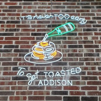 The Toasted Yolk Cafe - a neon sign on a brick wall - Breakfast & Brunch Near Me - Addison, Texas The Toasted Yolk Cafe - a neon sign on a brick wall - Breakfast & Brunch Near Me - Addison, Texas