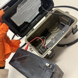 GSM Outdoors - Attempting to clean/dry out. Battery acid ate the positive prong up.