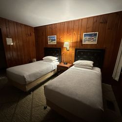 Inside of room with two twin beds