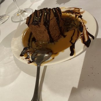 Owl Cafe - Chocolate mousse cake with dark chocolate and toffee sauce Yum - Bars Near Me - Apalachicola, Florida