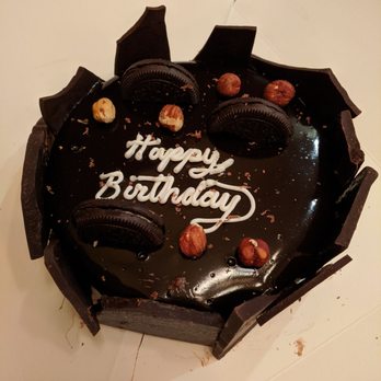Frost Gelato - An absolutely aces birthday gelato cake: dark chocolate and roasted almond gelato, chocolate hazelnut filling, and vanilla cake. - Gelato Near Me - Tucson, Arizona