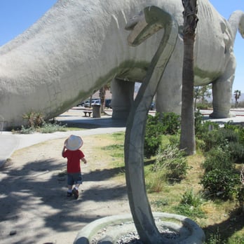 Cabazon Dinosaurs - Run from the titanboa my little explorer!  What a fun attraction we stumbled on! - Museums Near Me - Cabazon, California