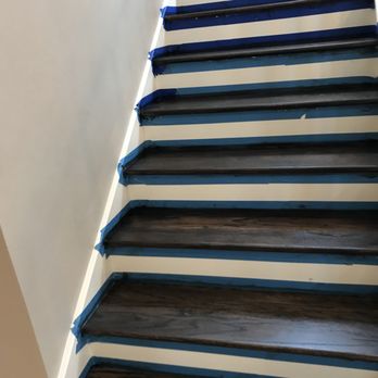 Roberts Hardwood Flooring Services - a close up of a painted stair - Flooring Near Me