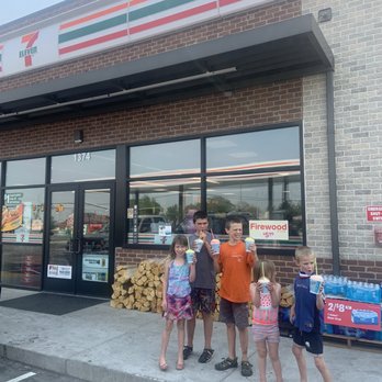 7-Eleven - a group of children standing outside a krispy kreme store - Convenience Stores Near Me - Springville, Utah