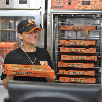 Little Caesars - a woman holding a box of pizza - Pizza Near Me - Mobile, Alabama Little Caesars - a woman holding a box of pizza - Pizza Near Me - Mobile, Alabama