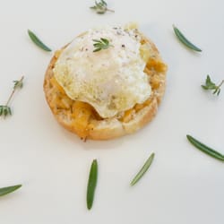 JLR Gastro Club - aged cheddar herb de provence bread topped with a quail egg and fresh summer truffle.
