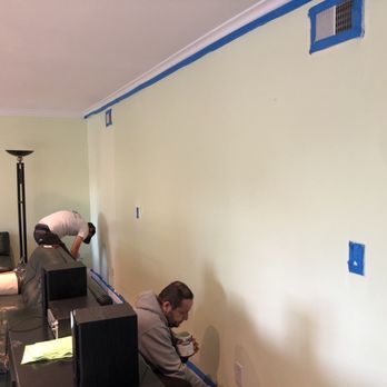 Pacific Environmental & Abatement Solutions - Prepping the wall for painting. - Environmental Abatement Near Me - Garden Grove, California