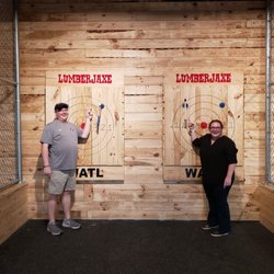 LumberJaxe - Axe Throwing Hall - The last shot of the game you try and hit the blue dot. Shocked we both got it!