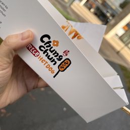 a hand holding a piece of paper a hand holding a piece of paper