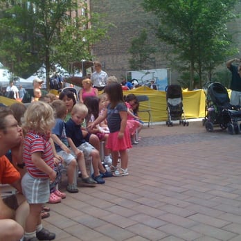 Printers Row Lit Fest - Kids listening to Justin Roberts at Lit Fest - Festivals Near Me - Chicago, Illinois