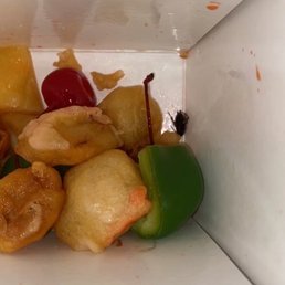 Sweet & Sour Pork with roach in bottom of box....scrumptious! Sweet & Sour Pork with roach in bottom of box....scrumptious!