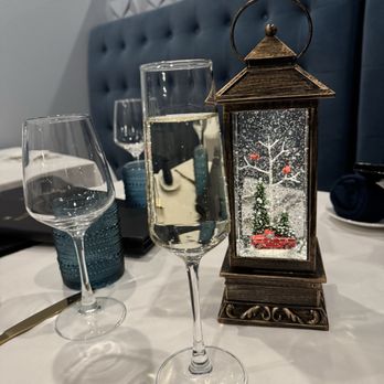 Isabella’s - Cute table decor for Christmas. Every table had a swirling lit up glitter lantern - - Italian Near Me - Bentonville, Arkansas