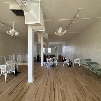 Sorella Coffee - a wooden floor and white painted walls - Coffee & Tea Near Me - Monroe, North Carolina