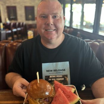 Lucille's Smokehouse Bar-B-Que - Michael Russell with a barbecue bacon burger - Southern Near Me - Long Beach, California Lucille's Smokehouse Bar-B-Que - Michael Russell with a barbecue bacon burger - Southern Near Me - Long Beach, California